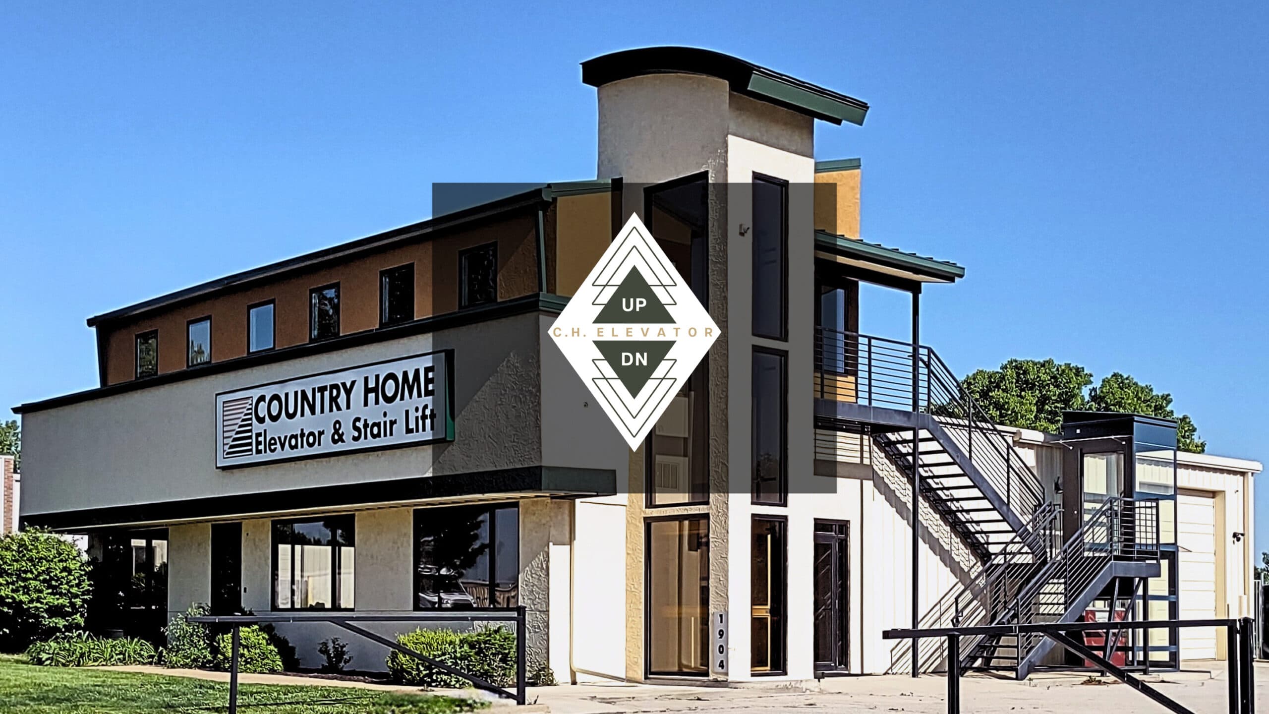 Country Home Elevator company building entrance against a blue sky